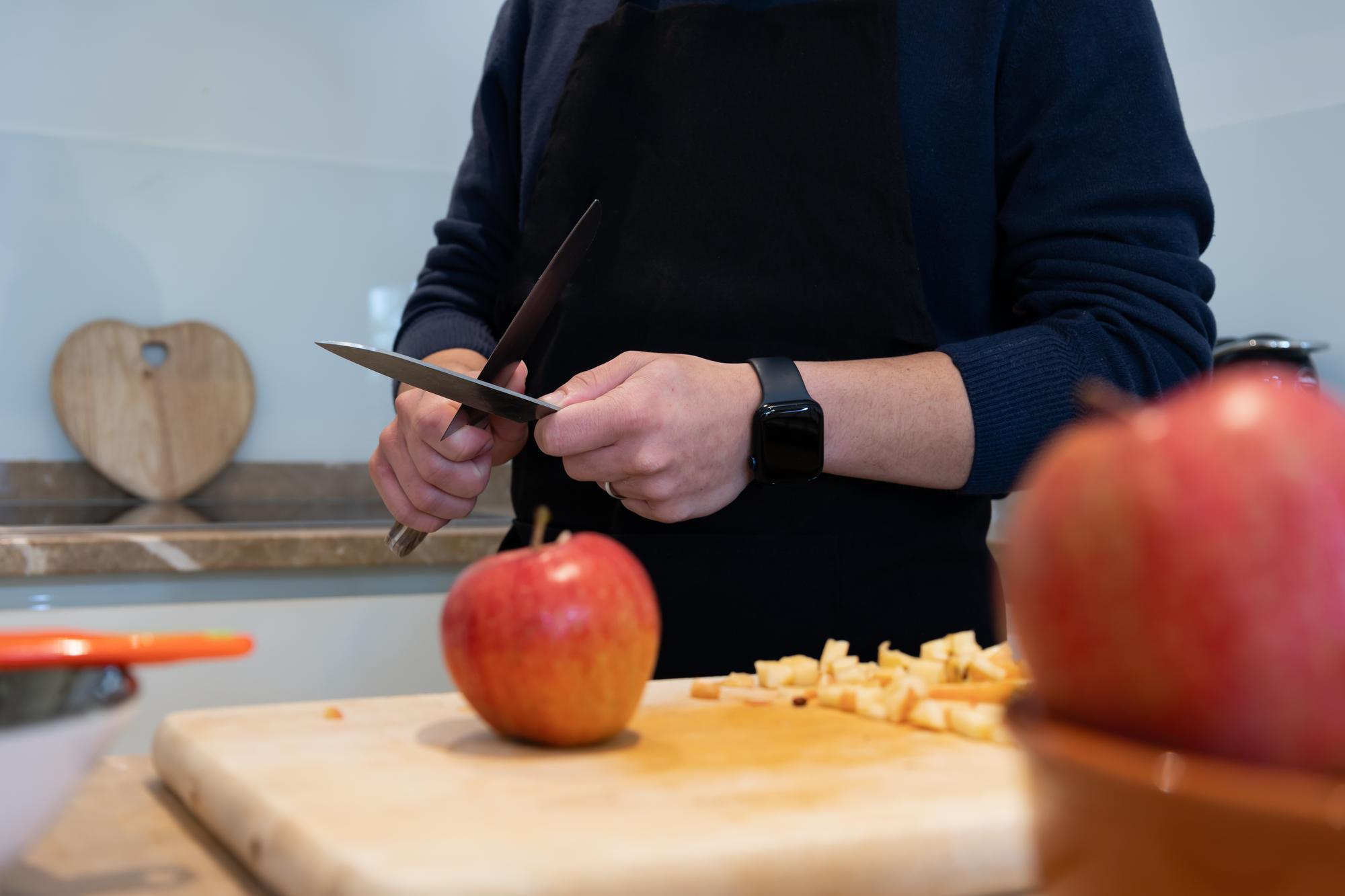 Instructor teaching chopping technique